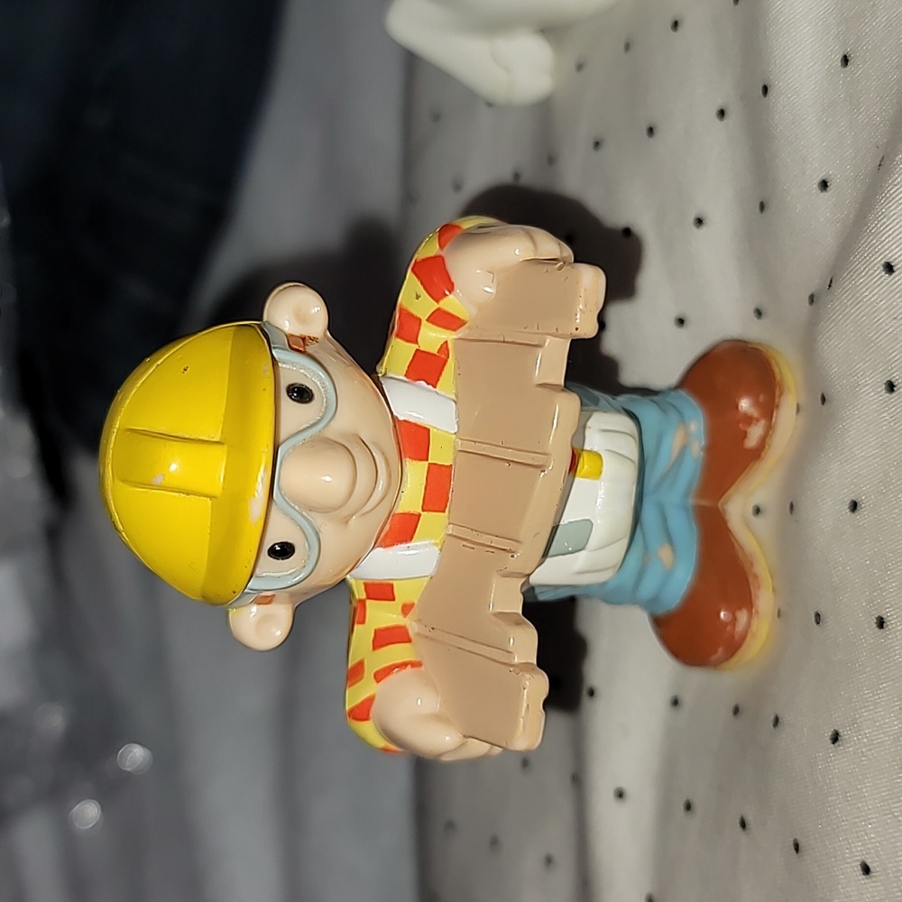 2000 Bob the Builder Figure holding wood figure.